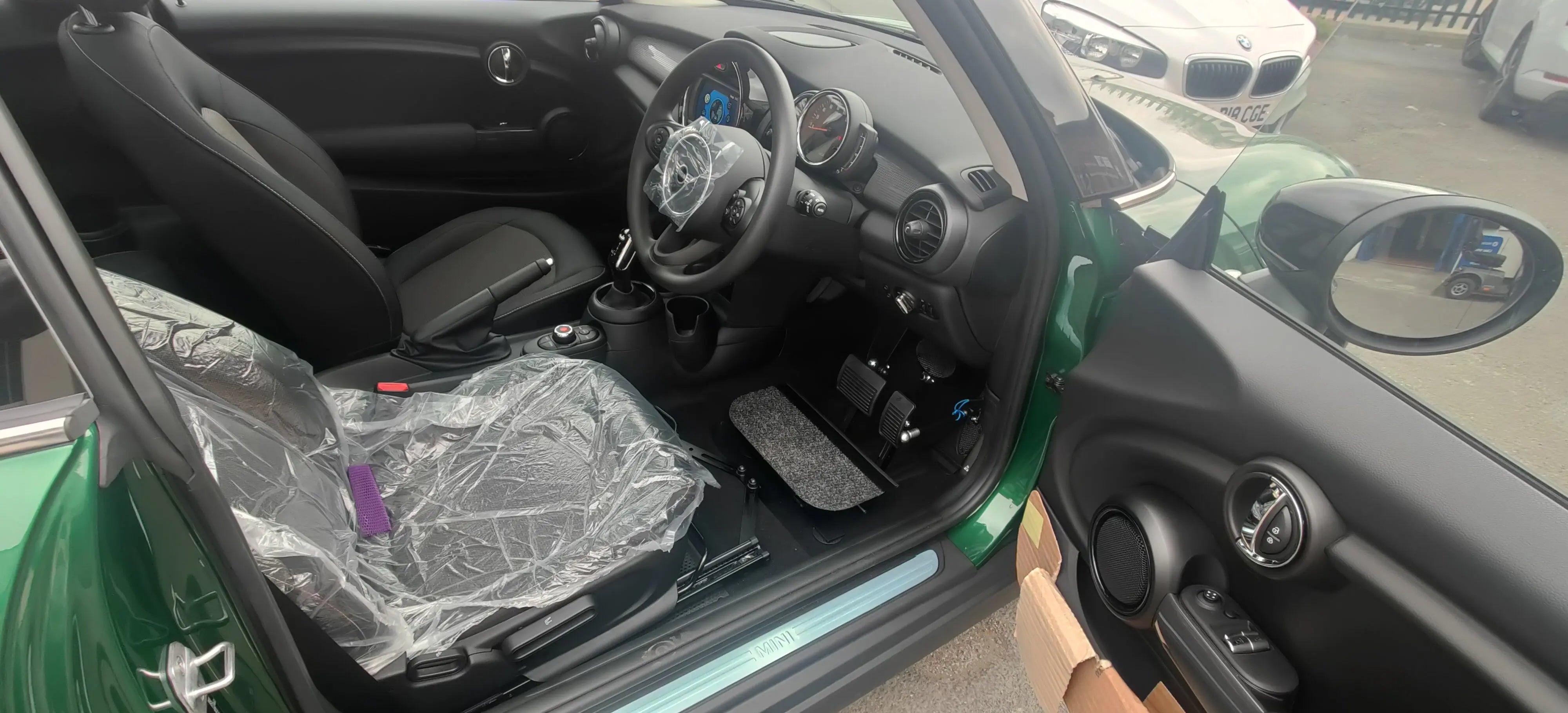 Menox pedal extensions with false floor fitted in a mini with a boot strap